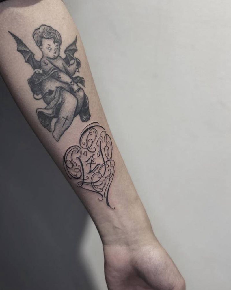 花体字纹身图片_手臂花体字纹身图案