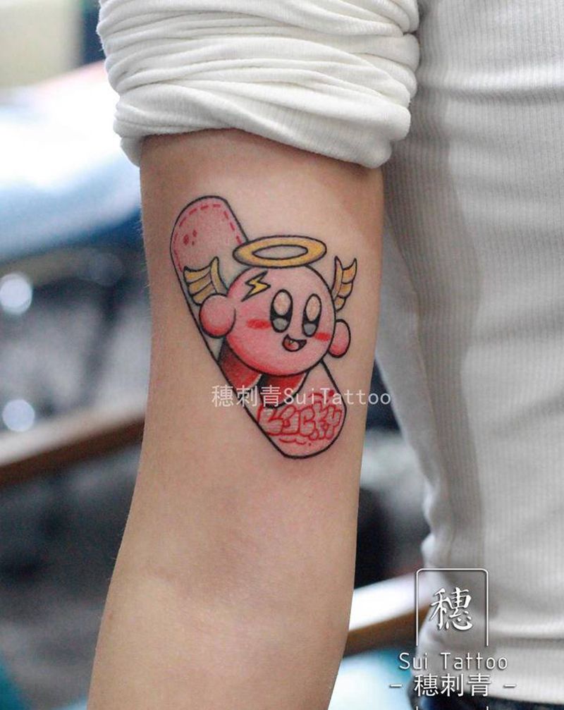 星之卡比纹身图片_手臂卡通纹身图案