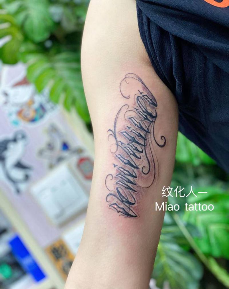 奇卡诺纹身图片_手臂花体字纹身图案