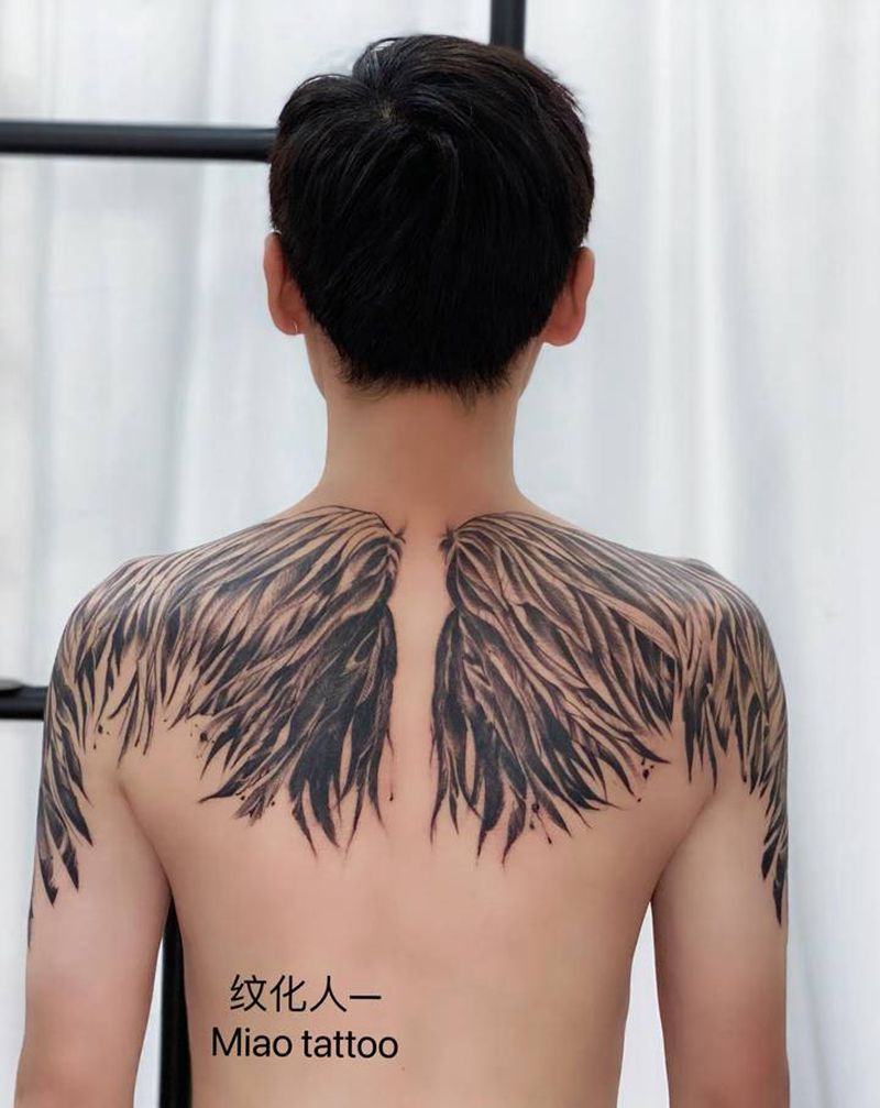 羽翼纹身图片_肩部背部水墨点刺纹身图案