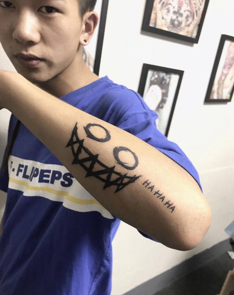 笑脸纹身图片_图腾纹身图案