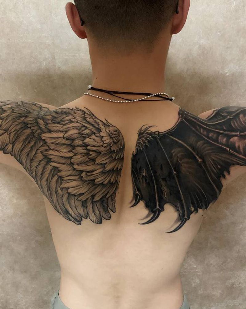 善恶翅膀纹身图片_肩部颈部欧美写实点刺纹身图案
