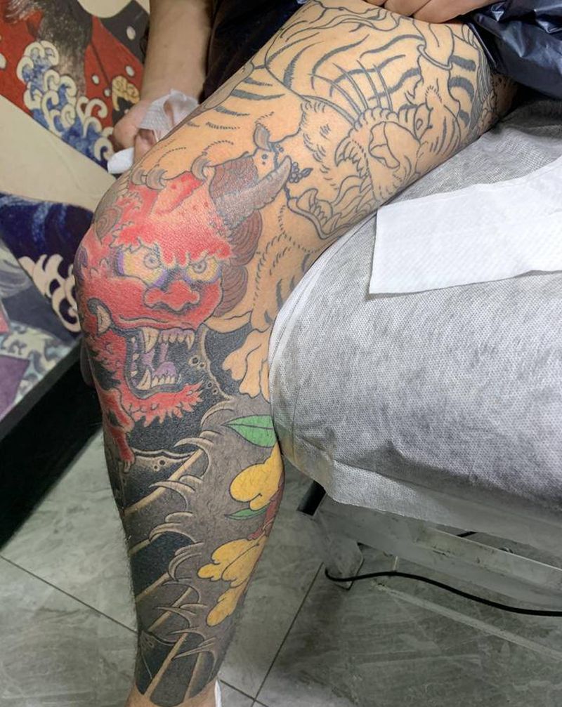 老虎斗鬼纹身图片_腿部老传统老虎纹身图案