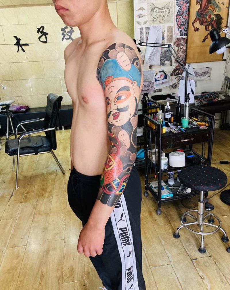 老传统财神纹身图片_手臂老传统纹身图案