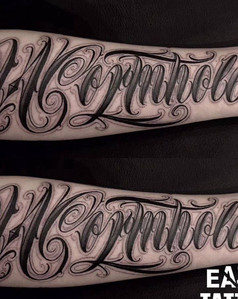 Wormhole纹身图片_手臂花体字花体纹身图案