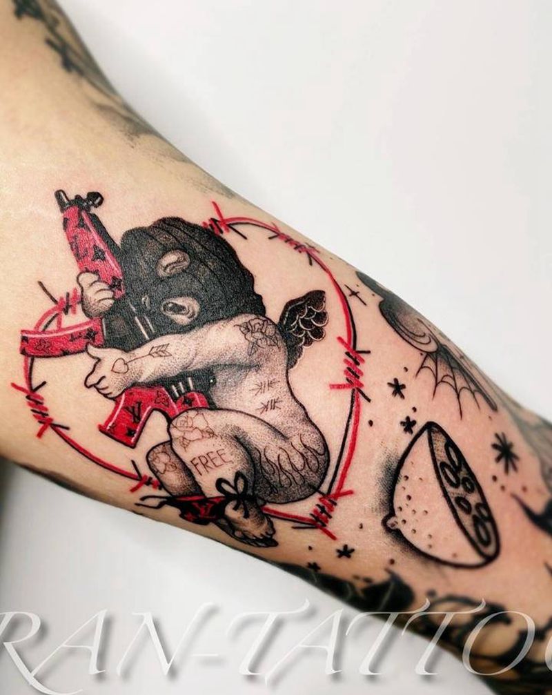 匪帮暗黑小天使纹身图片_手臂腿部New School点刺天使爱心枪纹身图案