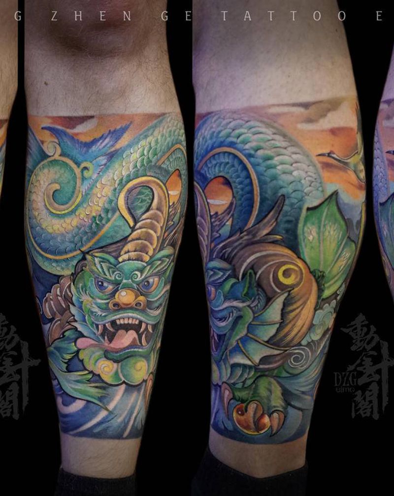 灵山出龙纹身图片_腿部新传统螭吻龙海浪纹身图案