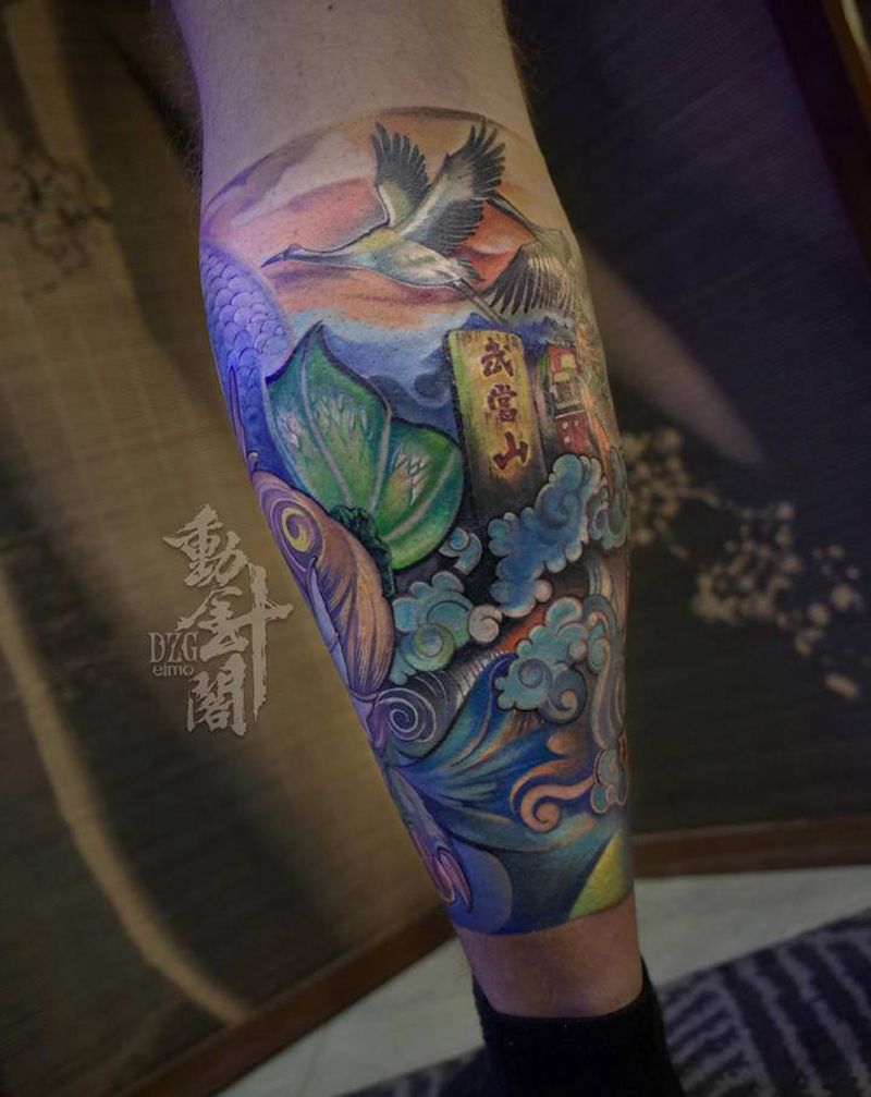 灵山出龙纹身图片_腿部新传统龙螭吻山纹身图案