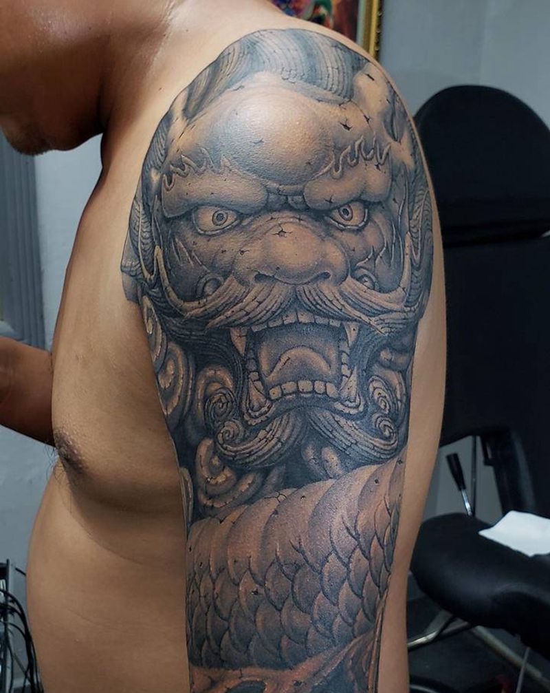 石雕龙遮盖小臂纹身图片_手臂欧美写实纹身图案