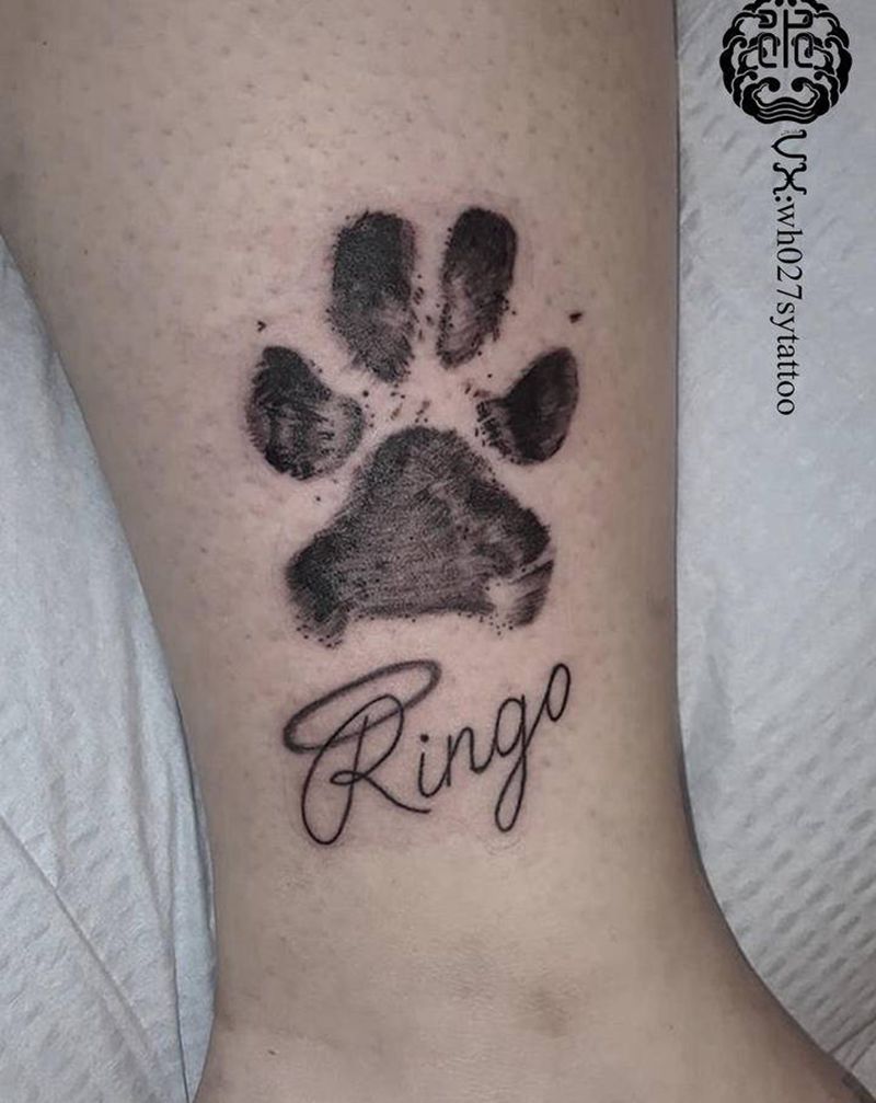 狗爪纹身图片_腿部欧美写实狗狗爪纹身图案