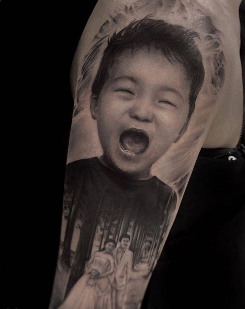 父爱如山纹身图片_手臂欧美写实纹身图案