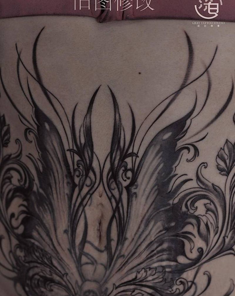 旧纹身修改纹身图片_腹部欧美写实翅膀纹身图案