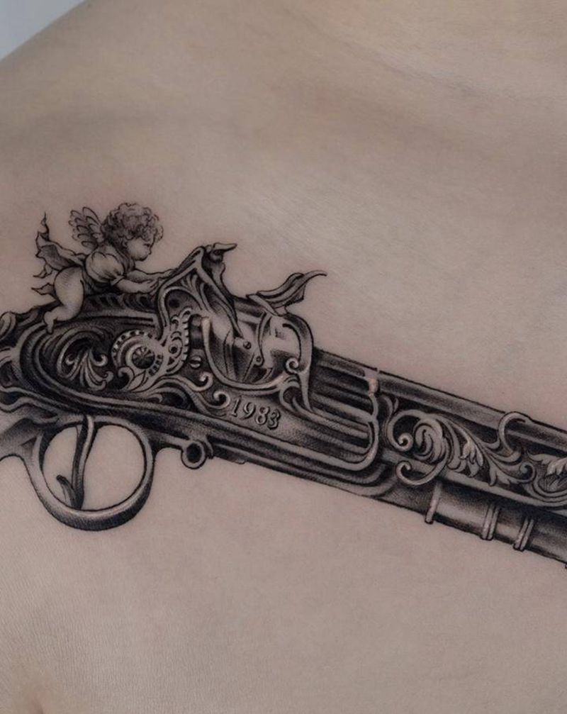 火枪纹身图片_胸部肩部欧美写实枪天使纹身图案
