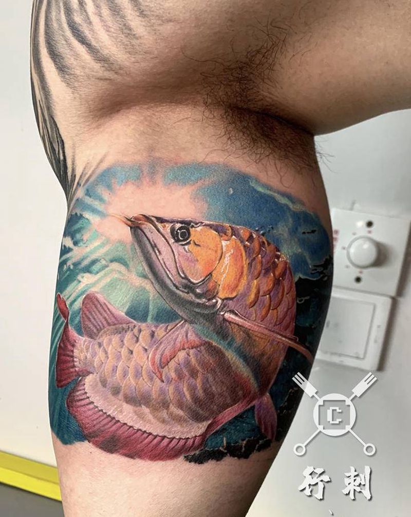 金龙鱼纹身图片_手臂欧美写实纹身图案
