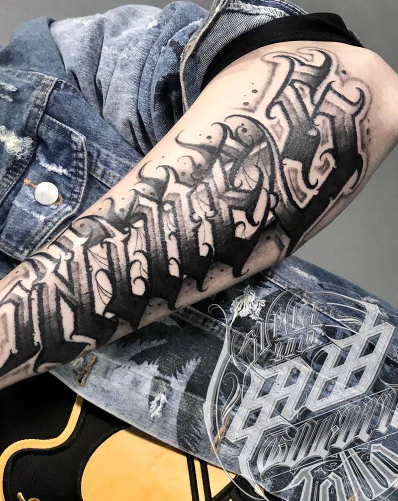 Nines纹身图片_手臂花体字纹身图案