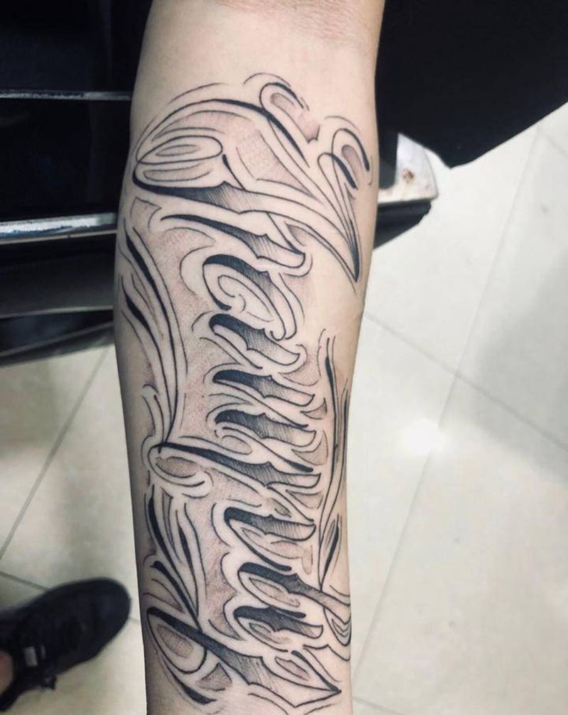 花体 伐木累纹身图片_手臂花体字纹身图案