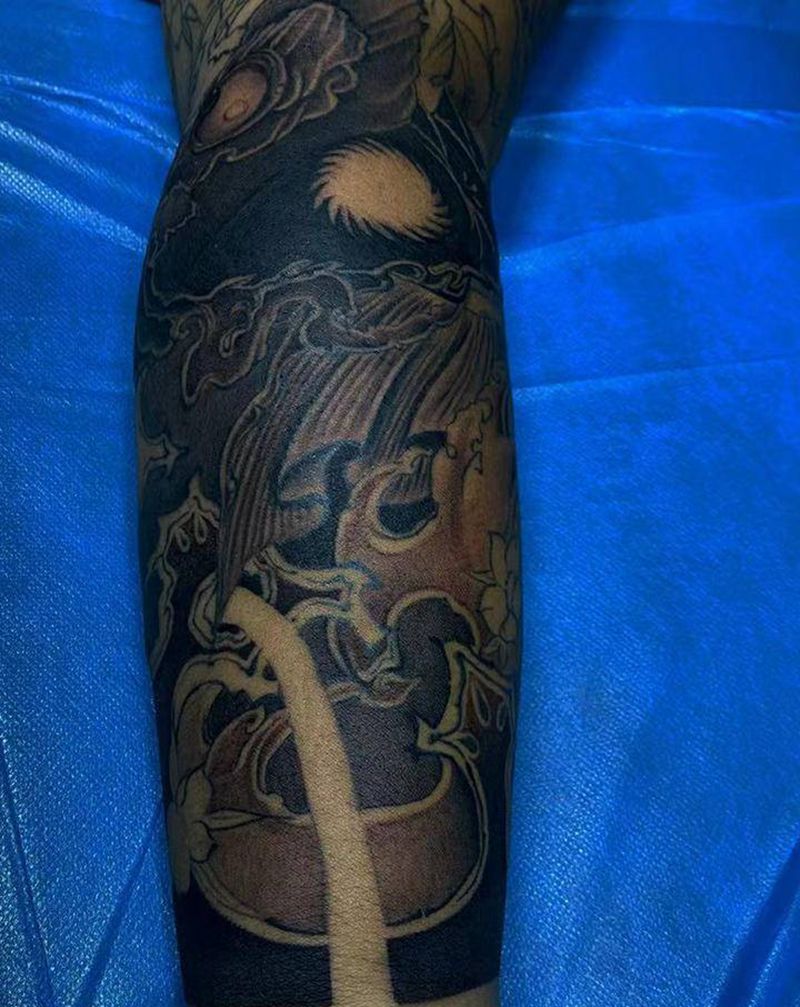 鬼若丸杀鱼纹身图片_手臂纹身图案