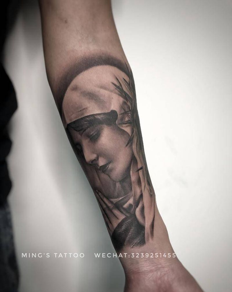 修女纹身图片_手臂欧美写实修女纹身图案