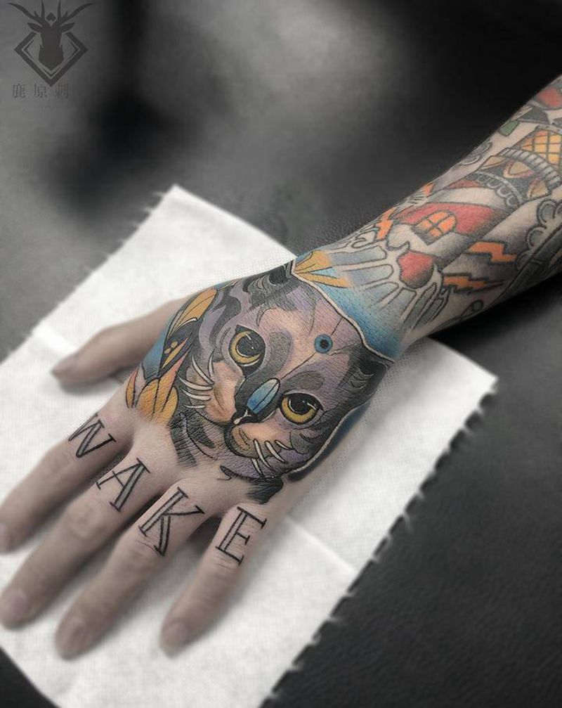 猫咪纹身图片_手部New School纹身图案