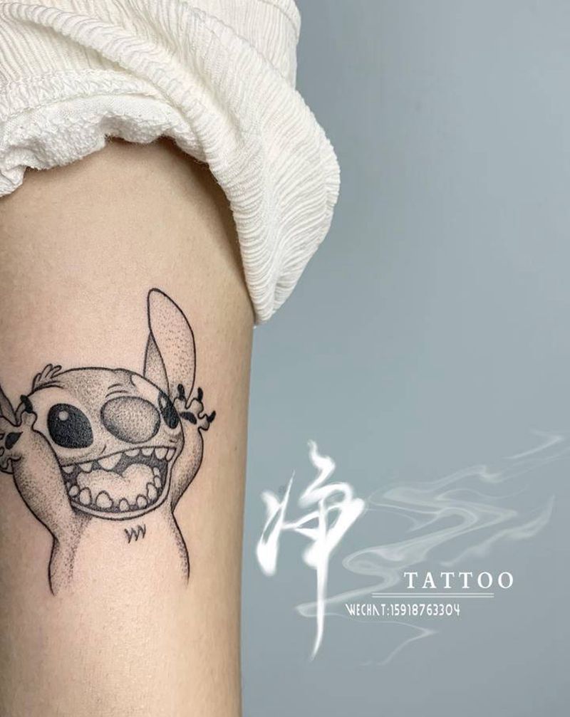 史迪仔纹身图片_手臂点刺史迪仔卡通纹身图案