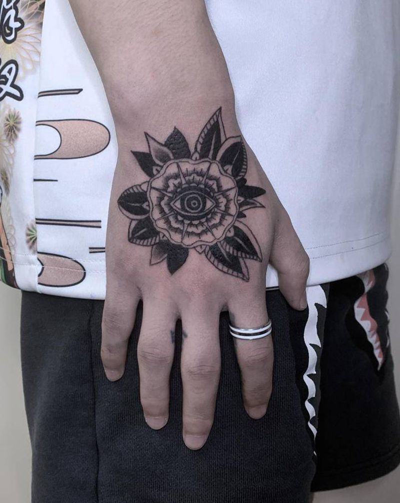 【花】纹身图片_手部Old School花眼睛纹身图案