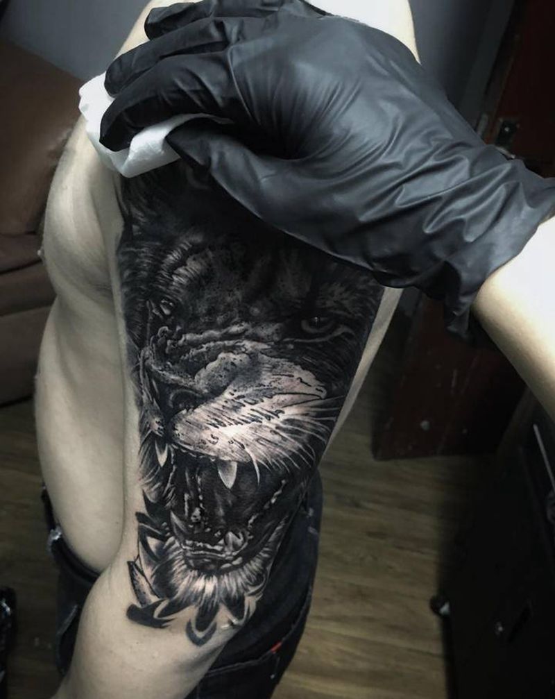 狮子进度白费百分之八十纹身图片_手臂纹身图案