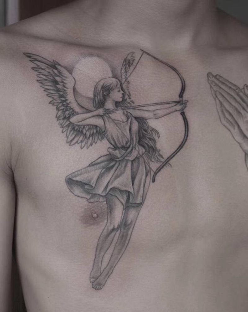 天使纹身图片_胸部卡通纹身图案