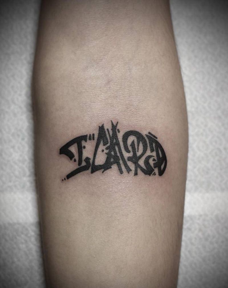 品牌logo纹身图片_手臂花体字纹身图案