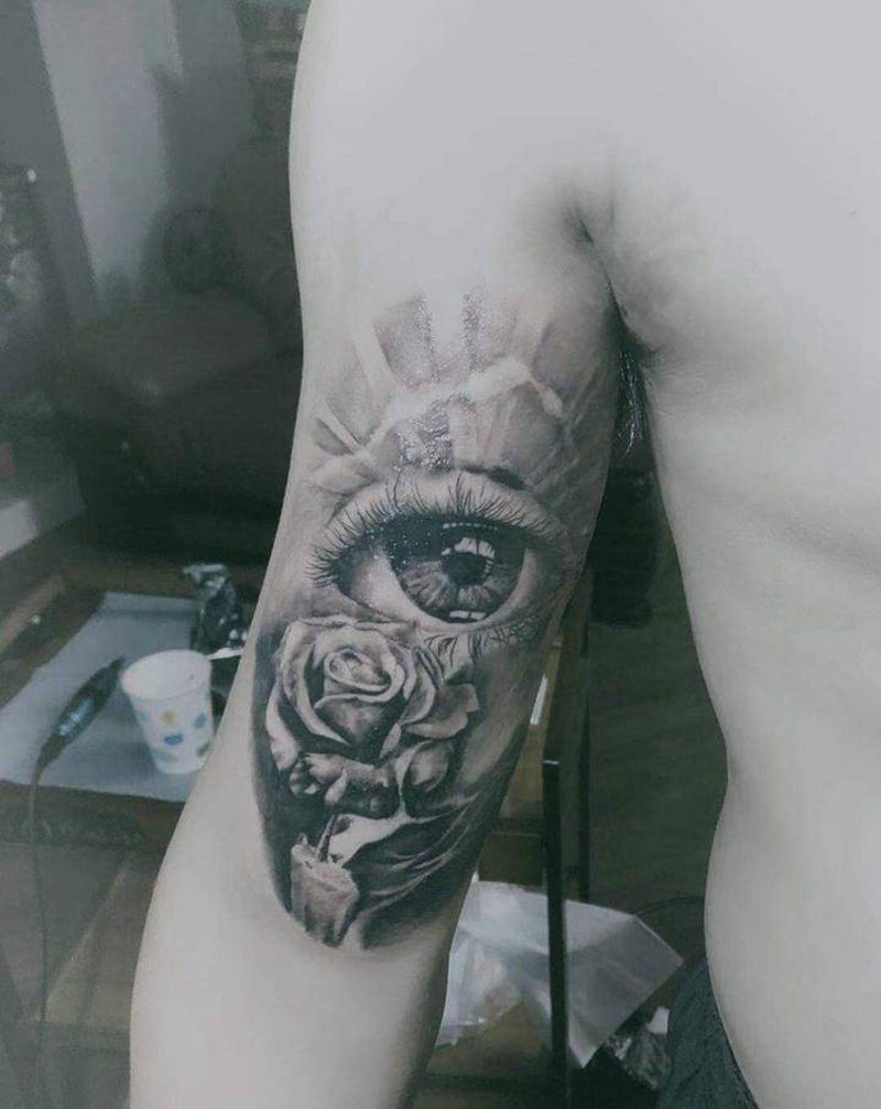 眼睛玫瑰纹身图片_手臂欧美写实纹身图案