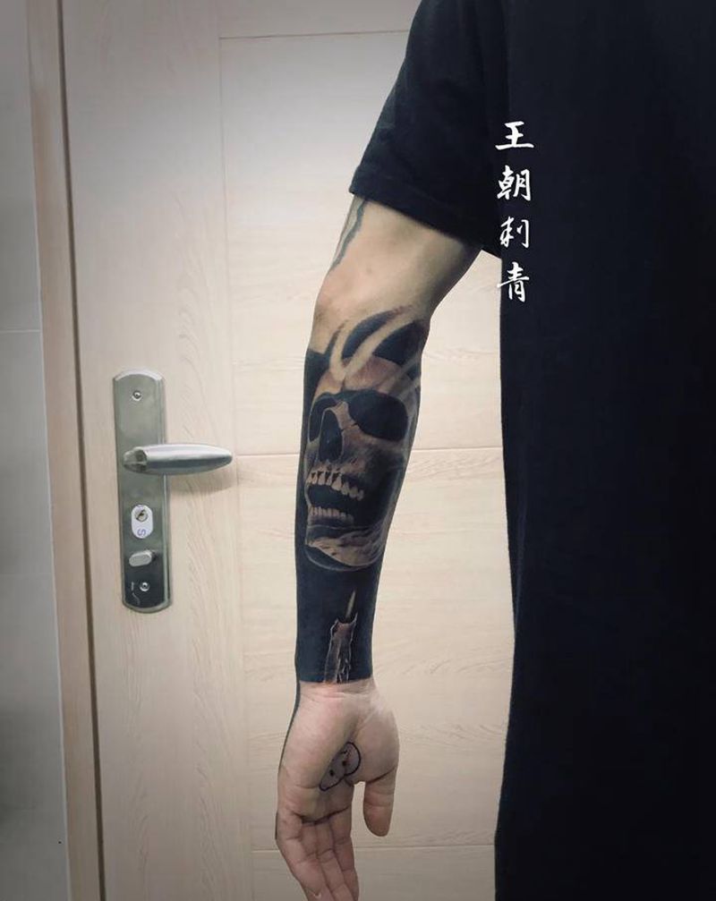 黑臂纹身图片_手臂欧美写实图腾黑臂骷髅纹身图案