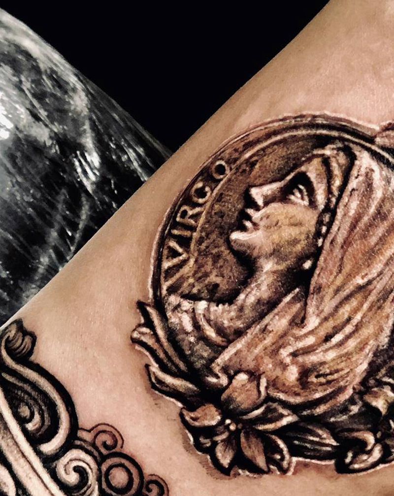 修女胸章纹身图片_手臂欧美写实点刺纹身图案