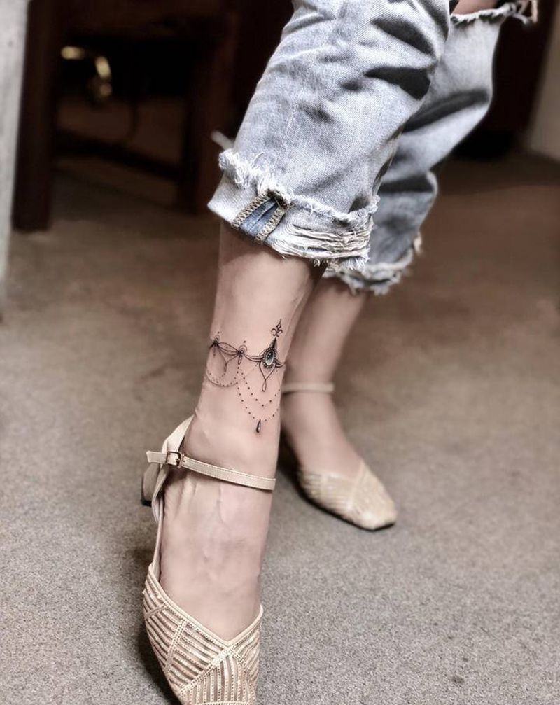 珠帘纹身图片_脚部点刺水彩纹身图案