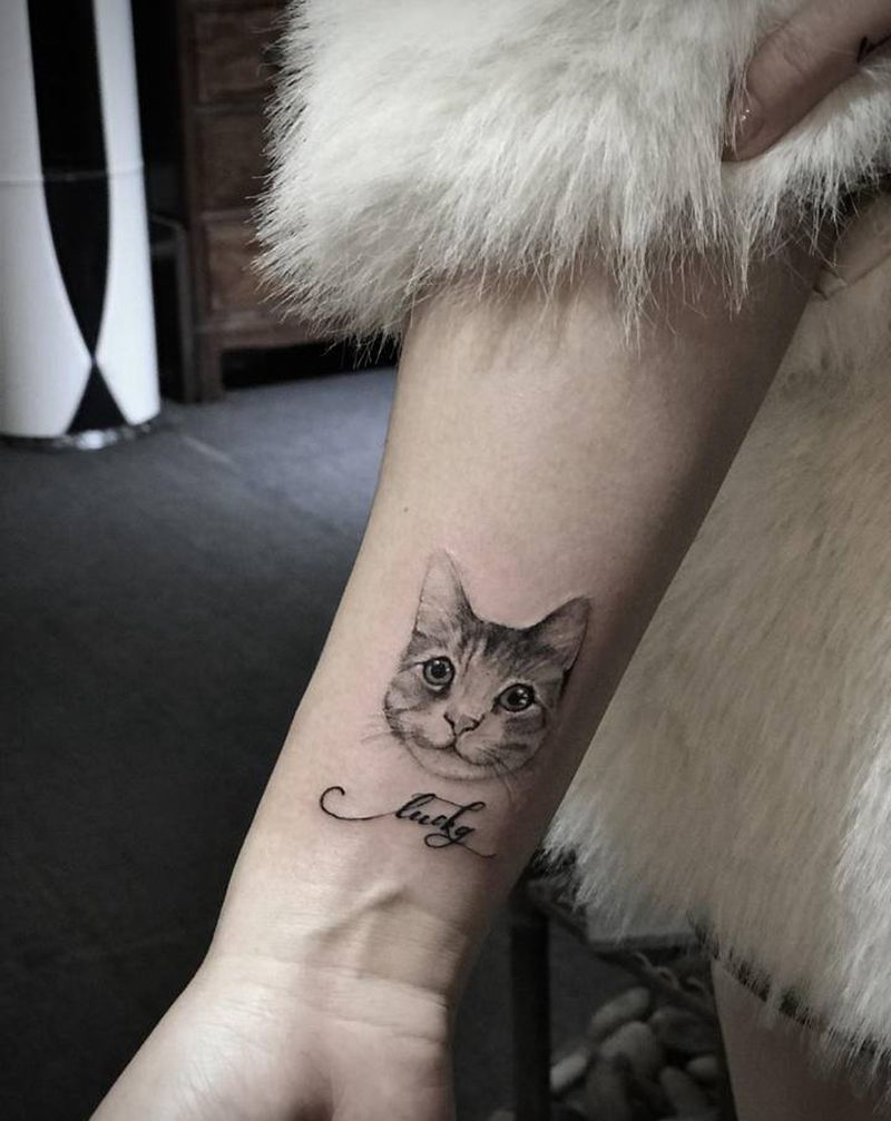 小猫咪纹身图片_手臂点刺纹身图案