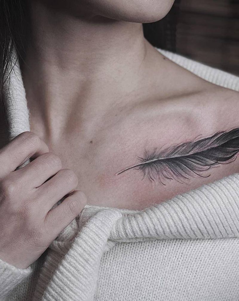 手绘羽毛纹身图片_胸部点刺纹身图案