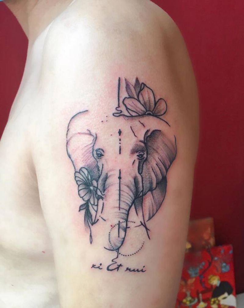 一位拥有两个女娃的父亲纹身图片_手臂点刺几何大象纹身图案