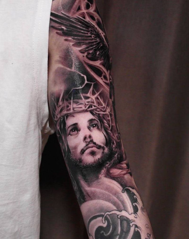 耶稣VS天使纹身图片_手臂欧美写实耶稣 天使纹身图案