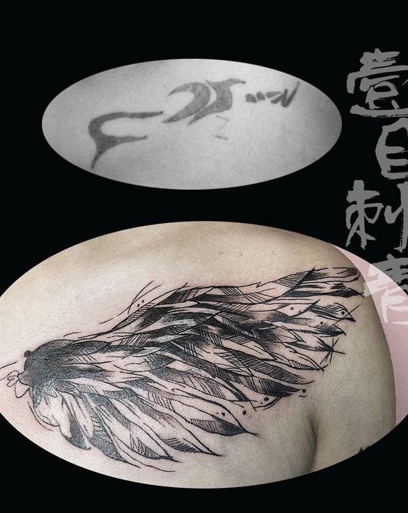 翅膀遮盖旧纹身纹身图片_胸部水墨纹身图案