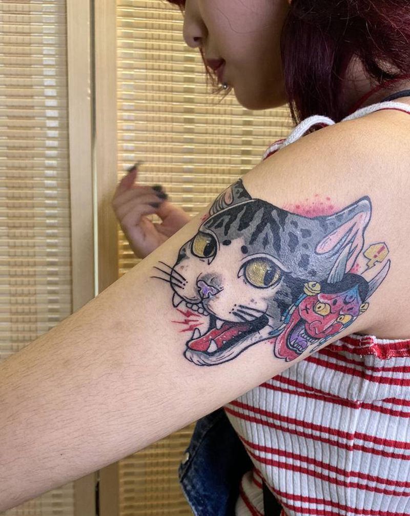 般若与猫纹身图片_手部纹身图案