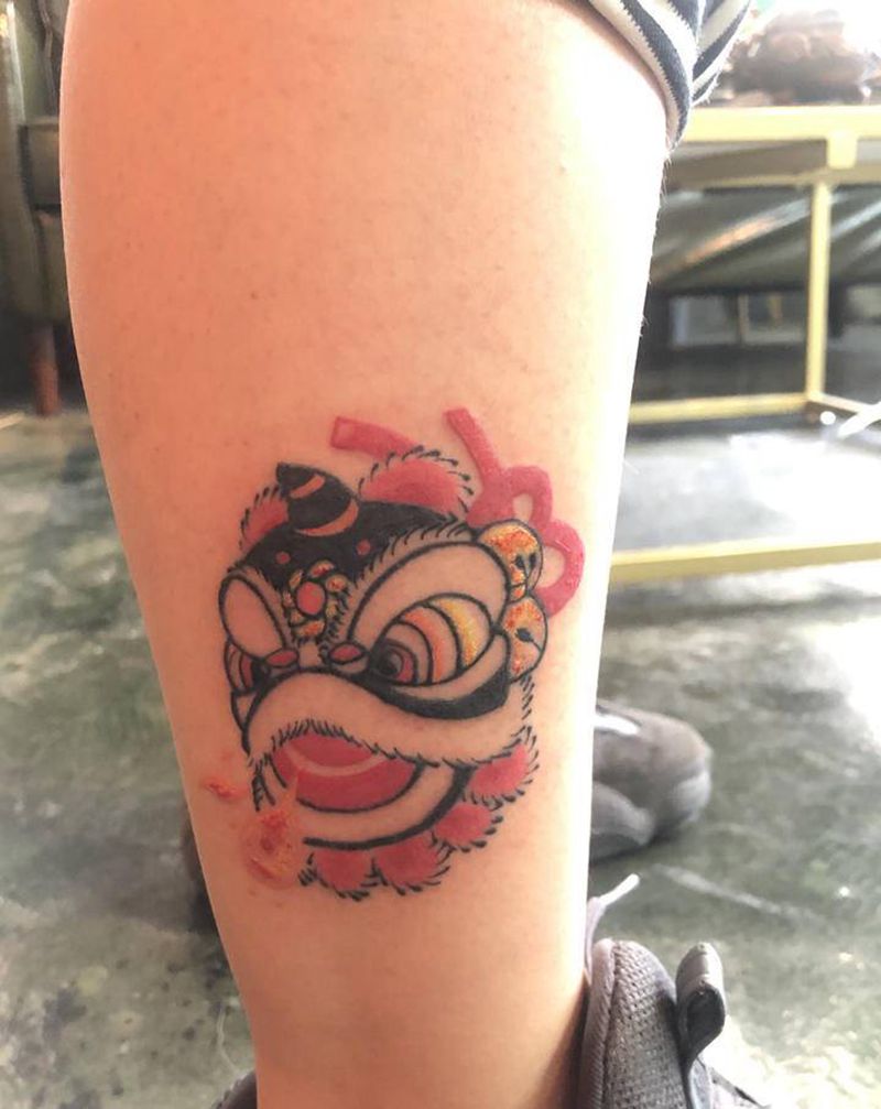 唐狮小图纹身图片_腿部新传统纹身图案