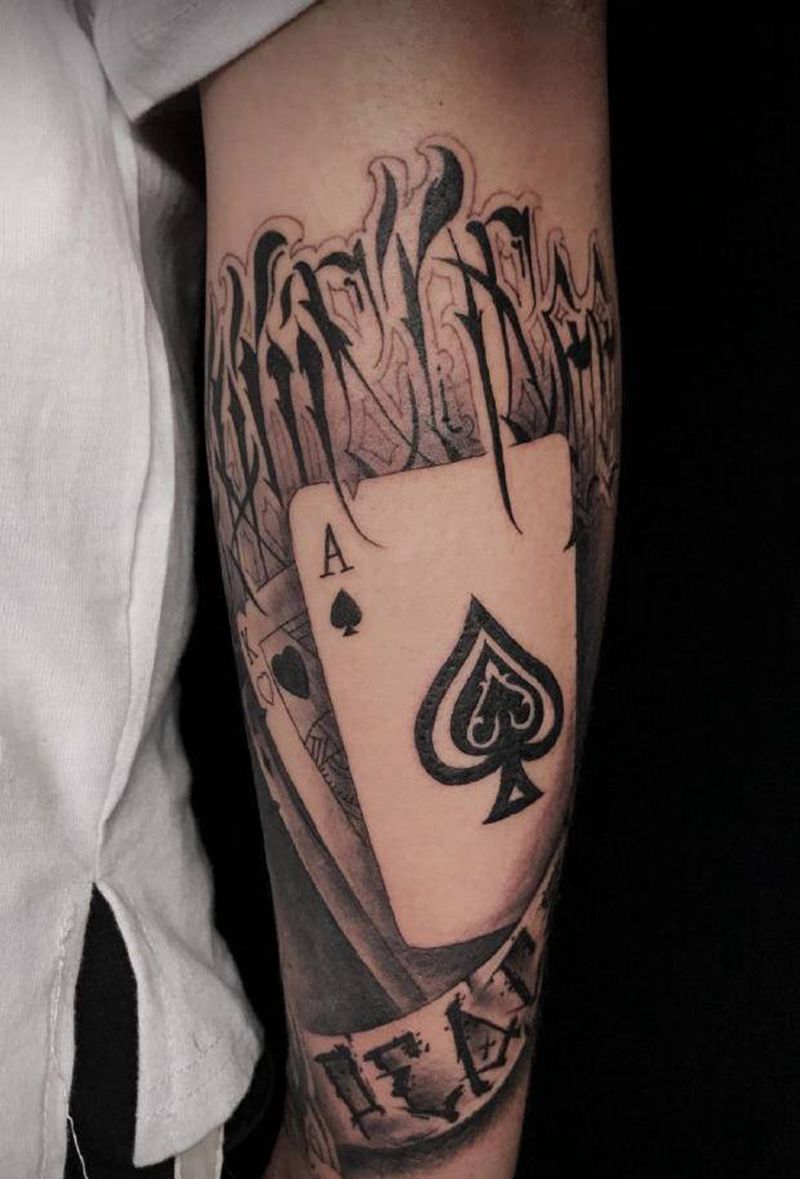 Gameness纹身图片_手臂手部花体字欧美写实扑克牌深圳花体字纹身图案