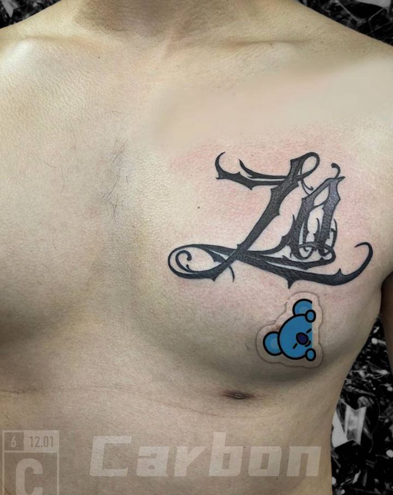 花体纹身图片_胸部花体字纹身图案