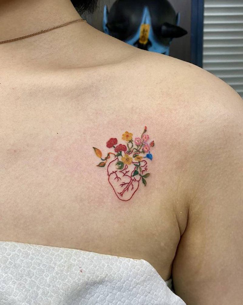 心脏纹身图片_胸部水彩纹身图案
