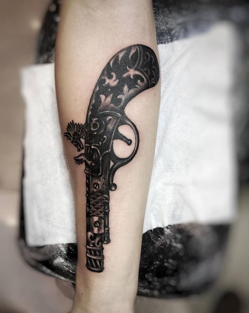 火枪纹身图片_手臂纹身图案