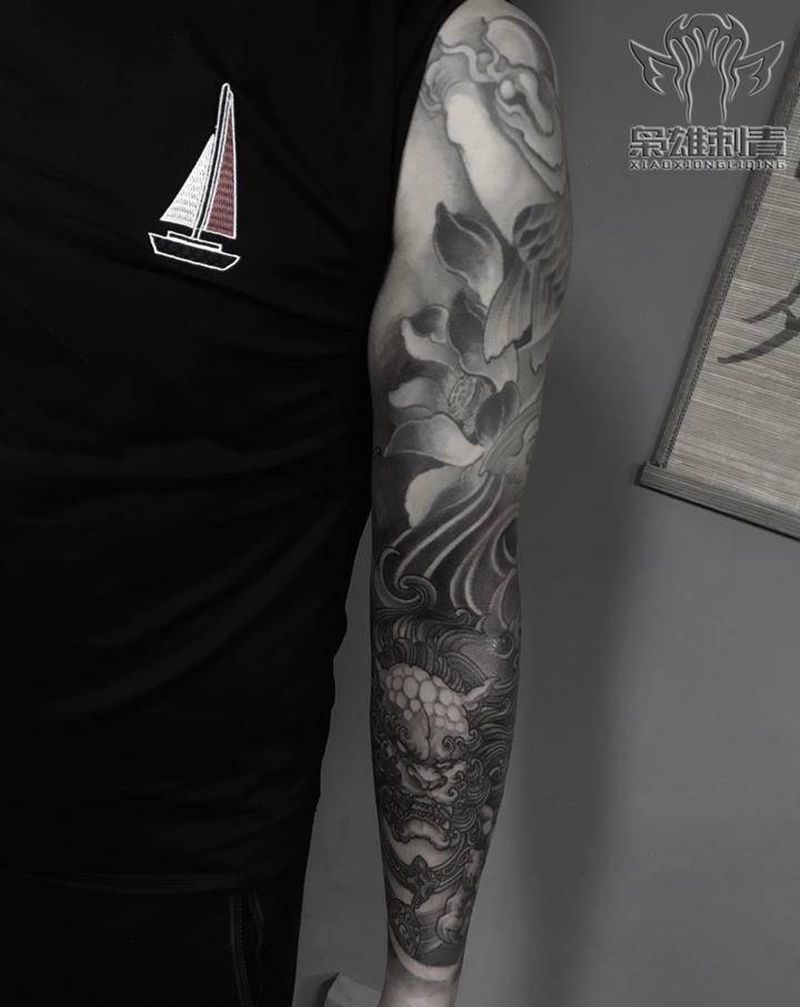 传统花臂纹身图片_手臂新传统鱼花臂唐狮鱼纹身图案