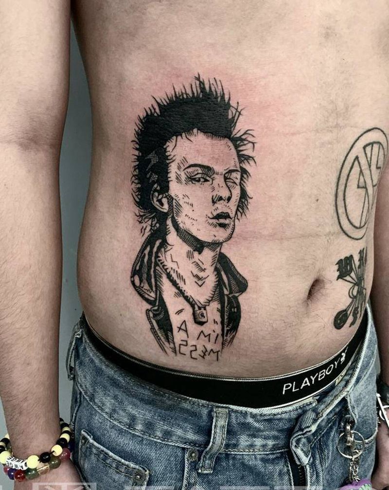 摇滚青年纹身图片_腹部纹身图案