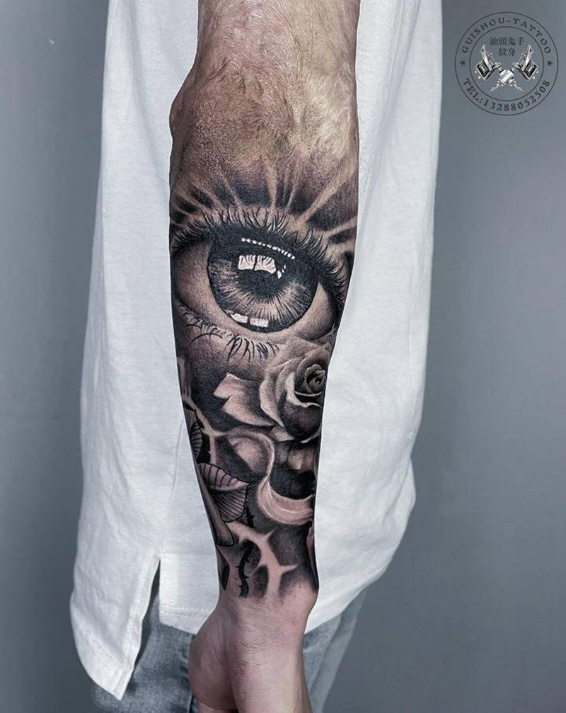 眼睛玫瑰纹身图片_手臂欧美写实纹身图案
