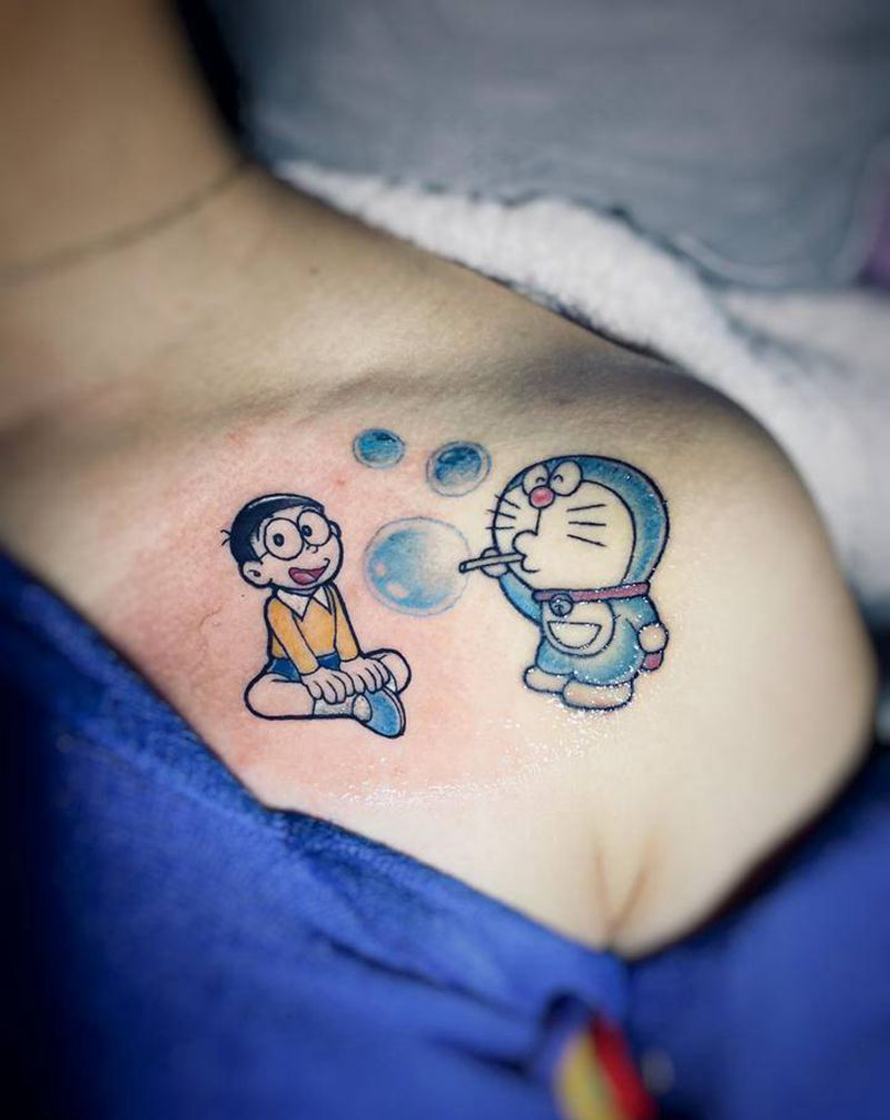 多啦a梦与大雄纹身图片_手部肩部New School水彩多啦a梦大雄纹身图案