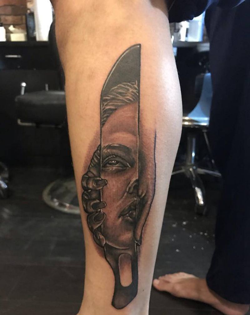 匕首纹身图片_腿部欧美写实纹身图案