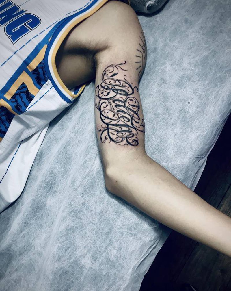 奇卡诺花体信仰纹身图片_手臂纹身图案