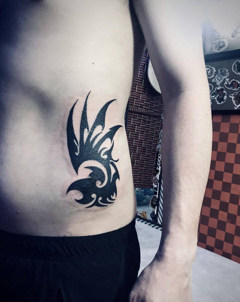 图腾遮盖纹身图片_腰部纹身图案